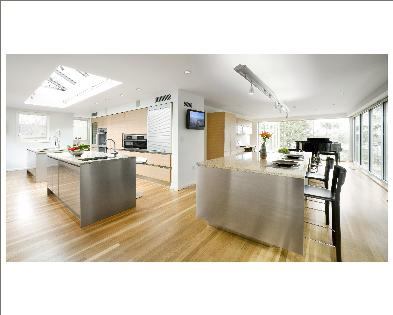 At left, two multifunctional islands offer prep space, a wash sink, and room for storage. On the right is a casual buffet area that can also be used for prep.