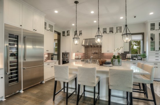 A wine refrigerator and built-in coffee machine give this kitchen in Quadrant's English Landing community an expensive feel.