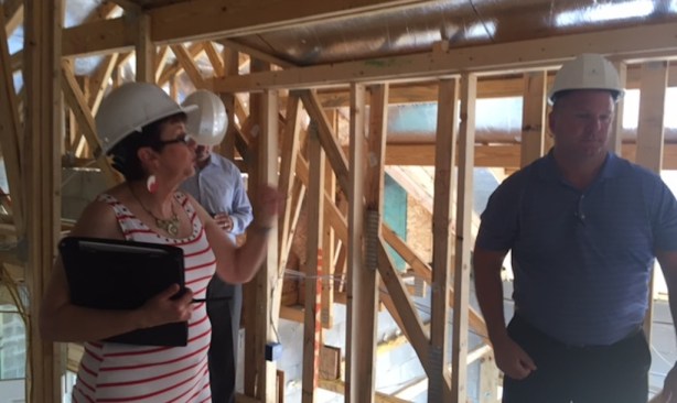 Architect Deryl Patterson and Taylor Morrison regional vp of construction Steve Atwood look for opportunity areas in what Patterson refers to as the "Florida basement" during the NEXTadventure Home frame walk at Esplanade, Highland Ranch, Clermont, Fla.