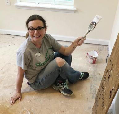 A HomeAid volunteer participates in the Atlanta chapter's "Care Day"