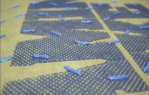 The plastic dots adhered to Benjamin Obdyke's Hydrogap housewrap hold the cladding off the sheathing and provide space for water to drain. This housewrap can be installed in any orientation.