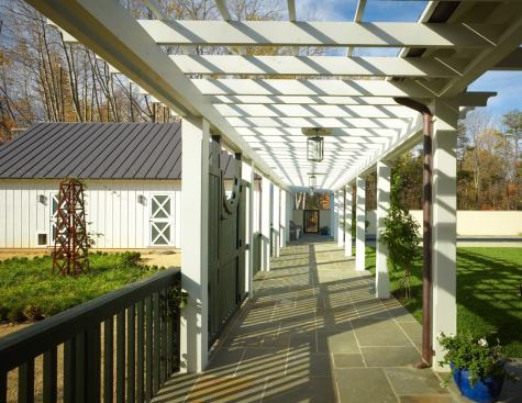A long pergola links the main house with the guest quarters and pool.