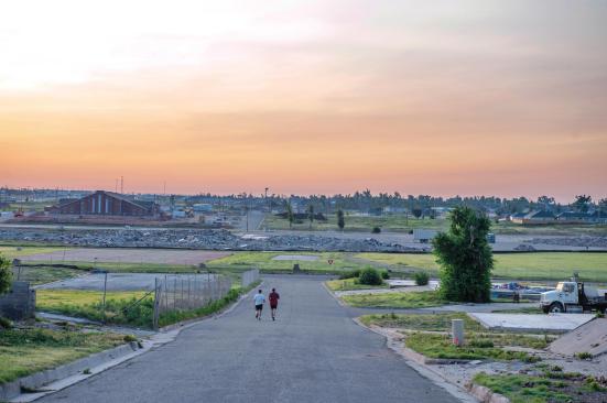 Rising from the Rubble Where Joplin High School used to stand, a pile of bricks and metal now sits. Lying in a designated flood plain, that location will become the new ball fields for the Joplin Eagles when the new school is built on a nearby rise.