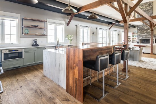 The barn’s original cedar siding was reused in the wine cellars, powder room, and kitchen island as a focal-point wall covering.
