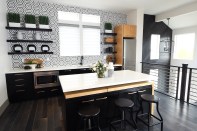 The second floor suite has a kitchenette for the flexibility to have separate living quarters for a renter, a caregiver, or an adult child.
