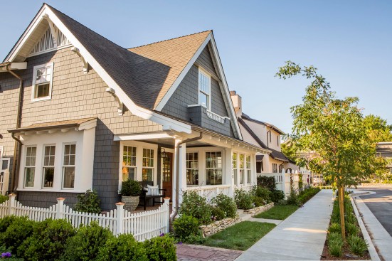 Each home has a brick front porch; lattice-topped fences offer additional privacy from the street.