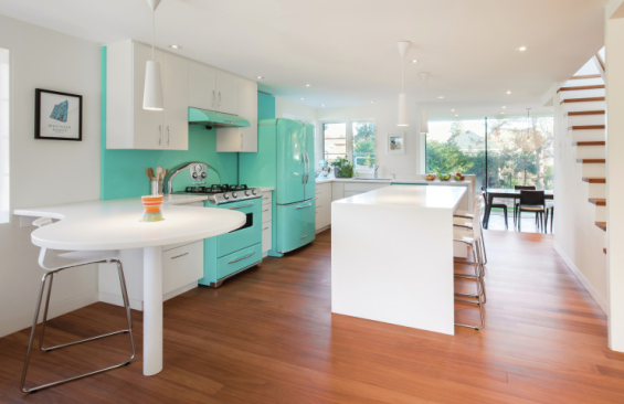 The retro-style kitchen features vintage-look robin’s egg blue appliances from Elmira Stove Works.