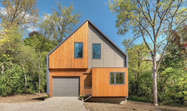 The Matchbox House's exterior is divided into distinctive quadrants of cedar planks and fiber-cement siding. It is insulated with a combination of closed-cell spray foam, cellulose, and foam board.  
