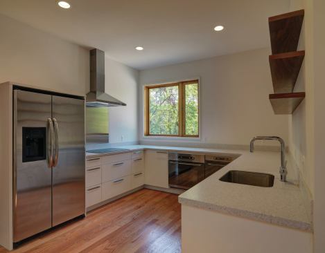The kitchen features recycled-content Corian countertops and IKEA Energy Star-labeled appliances.