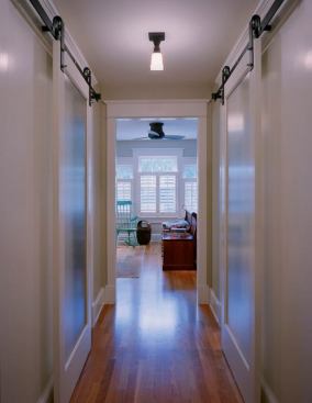 Built in 1919, this Craftsman bungalow had already survived a few changes when its new owners decided to give it a face-lift. Dedicated to restoring the home’s original 1920s character while allowing the space to meet the needs of a 21st-century family, Moore Architects employed sliding&nbsp;doors that leave hallway space uninterrupted. Beautifully detailed hardware stays true to the home’s original character as well as the careful attention that is a hallmark of the Craftsman style.
