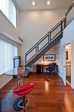 Rather than write off under-stair space as a dead zone—or an awkwardly shaped closet—the team at ICON architecture thoughtfully appointed this sleek, modern staircase that leaves room for a work nook underneath.