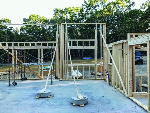 Concrete “cookies” used to brace the wall framing were only partially effective.