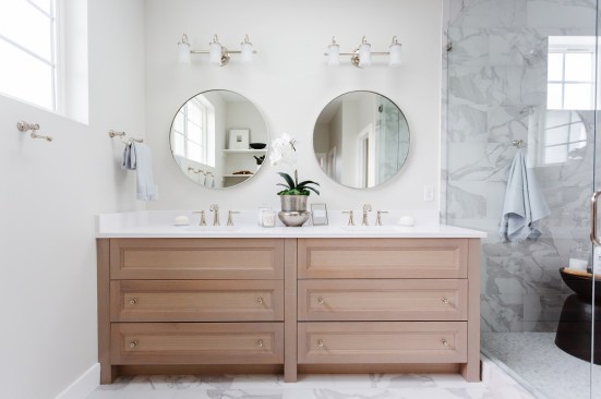Down a small private hallway, owners will find their en suite bath with a double vanity and an enclosed wet area with a tub and shower.