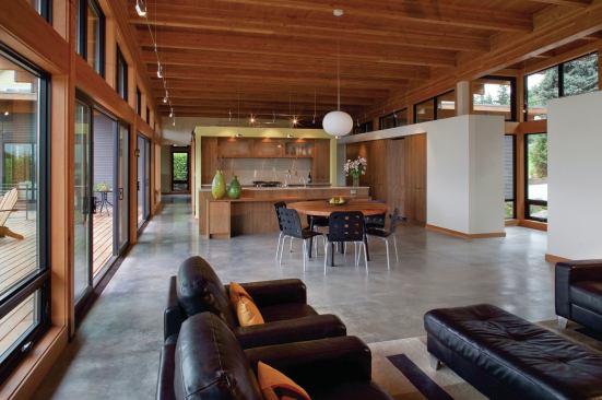 Designed for an elderly retired couple, the house has radiant-heated concrete floors and is as transparent as possible to capture views of the Columbia River and Mt. Hood. 