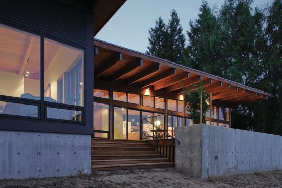 The deck incorporates a raised concrete plinth for gardening.