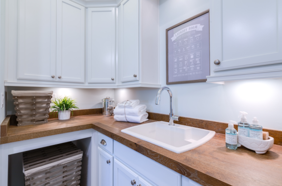 This laundry area is illuminated by subtle under-cabinet lighting. Learn more about products like this one in BUILDER's round up of stylish recessed and under-cabinet LED fixtures.