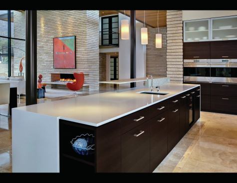 Rather than being a support space to the side, the kitchen is nearly adjacent to the front entry and an important foreground piece.