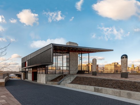 This crystal is, in turn, shrouded by a folded black zinc skin. This skin is selectively unfolded to provide panoramic views out of the upper level cafe. 