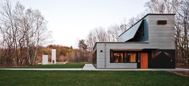The building was designed with Passivhaus principles, with heating primarily by direct passive solar gain from the south, and internal heat gain from equipment and occupants.