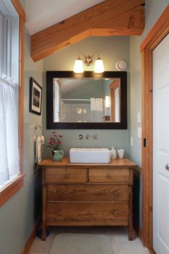 Lakeside Green's designer, Dennis Feltner, was familiar with SIPS and the area’s architectural review board’s requirements. White cedar was harvested from within a 250-mile radius for siding and the original cottage’s heart pine floors and plumbing fixtures were reused.