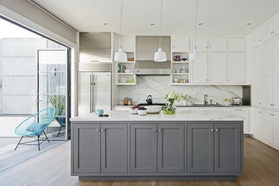 The kitchen, opposite the breakfast area has easy roof deck access via the NanaWall (www.nanawall.com). Traditional woodwork styling helps connect the modern with the traditional. Contractor Aaron Robinson made the cabinets.