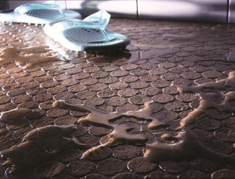 #4 Sustainable Flooring Showercork Flooring  Showercork flooring is made with &frac14;-inch pieces of cork cut from post-industrial wine corks. The durable material is suitable for wet applications such as shower floors and pool surrounds, is slip resistant, comes prefinished or unfinished, and offers thermal and acoustical properties. The sheets, which come 12 inches by 24 inches, are adhered with thinset or glue and then grouted. 303.544.6076. 
www.sustainableflooring.com.