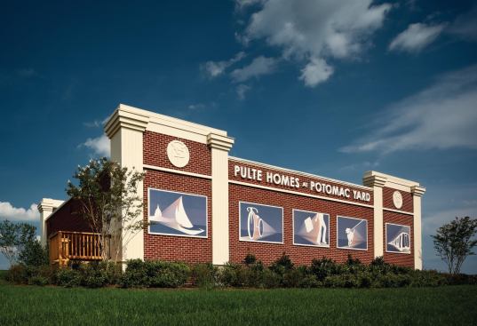 PulteGroup used up all its signage with the words at the top of the building, so it used murals to depict images of the community's lifestyle.