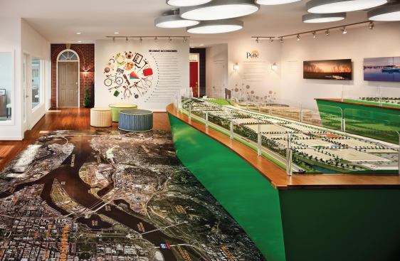 A huge aerial floor map of the area grabs home shoppers' attention when they walk in the door.