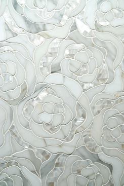 Chrysanthemum, an addition to the Perlamarmi Collection, is designed to add glamour to any home. The mosaic tile forms petals of polished Calacatta Gold marble and white natural rivershell waterjet-cut inserts. Artistic Tile. 212-727-9331. 
www.artistictile.com.&nbsp;