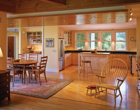 A new kitchen and modestly expanded dining area work the kinks out of the ell's old floor plan.