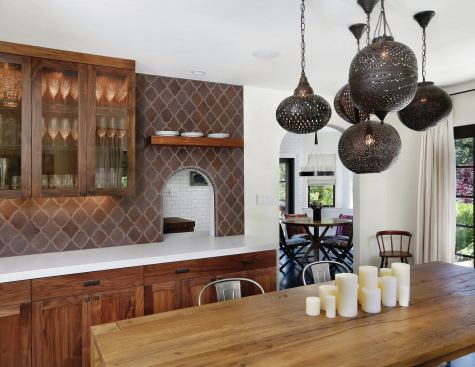 The dining room entry is arched, and the pass-through follows the same lines. Using it makes serving dinner to guests in the dining room a simple thing.