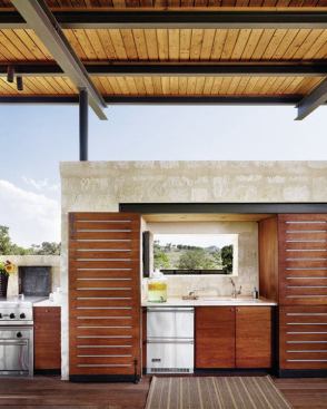 Designed for frequent entertaining, the full kitchen includes a grill, oven, dishwasher, refrigerator, and sink.
