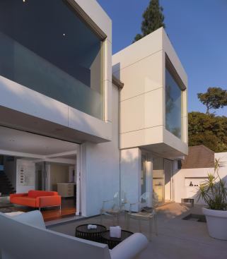 Clad in Ivory Carat concrete boards, the two window boxes stand as sentinels over the revamped entry courtyard.

