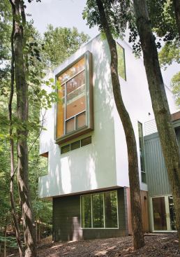 Because the site is steep, architect Janet Bloomberg says she could not add space to the back of the house. The tower provides additional square footage without disturbing any trees.
