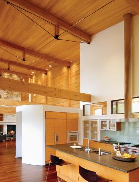 A window wall scoops indirect daylight into the interior.