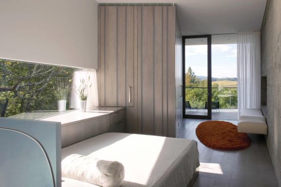 2011 CHDA  Custom Home of the Year  House in an Olive Grove, Geyserville, Calif.  Cooper Joseph Studio, New York City   Architect Wendy Joseph of Cooper Joseph Studio captured views&nbsp;and maintained privacy&nbsp;in this cozy bedroom with fixed horizontal glazing that suits the gaze from the adjacent built-in bed. The far wall is&nbsp;all glass and connects to a small balcony jutting out over the olive groves on the property. Those two&nbsp;carefully curated windows offer close-up and distant views of the surrounding countryside.