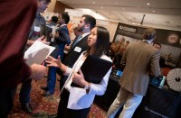 Jennifer Willard, a first-year student at the Myers-Lawson School of Construction, speaks with recruiters from Scott Long Construction during the fall career fair at the Inn at Virginia Tech.
