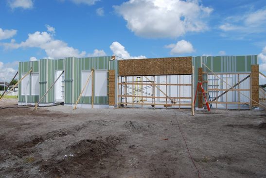 Panelized construction techniques reduce labor demands.