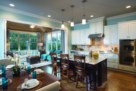 The open floor plan of the Bellemede model at Ruth’s Farm in Alpharetta, Ga., features a gourmet kitchen with an island, a breakfast room, and view to the vaulted family room.