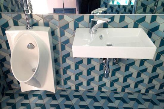 The experimental bathroom, designed by Caltech engineers and funded by the Bill & Melinda Gates Foundation, runs on solar power to flush, disinfect, and recycle human waste into water for the toilet, urinal, sink, and “squat pan” that are part of the side-by-side restroom and treatment unit.