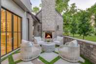 Small backyard with fireplace and seating area