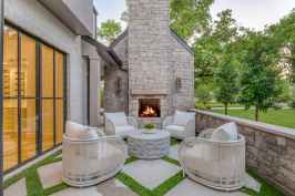 Small backyard with fireplace and seating area